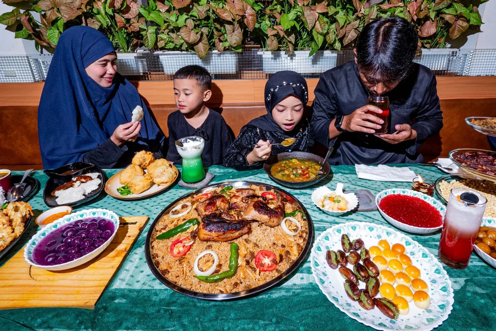 A family gathered around a shared meal during Ramadan.