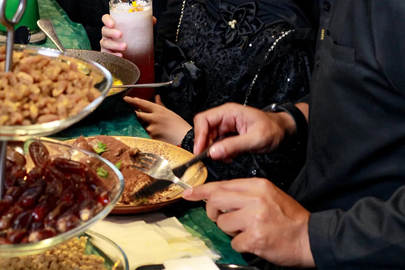 A family sharing a meal together during Ramadan.